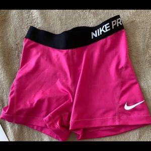 Bright Pink AS Nike Pro athletic shorts